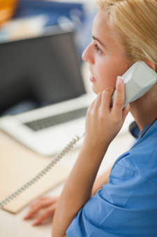 Woman in office talking on phone