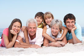 Family relaxing on beach