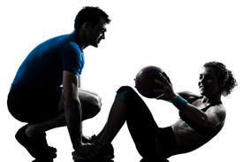 Woman working with athletic trainer