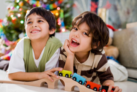 boys play with holiday gifts