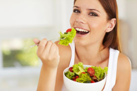 woman eating salad