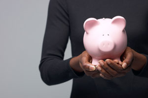 Woman holding piggy bank