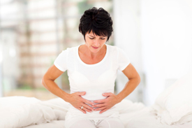 Woman holding stomach