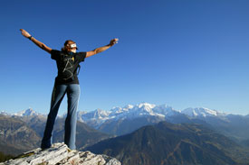 Woman standing on mountain top