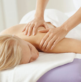 Woman receiving massage therapy. 