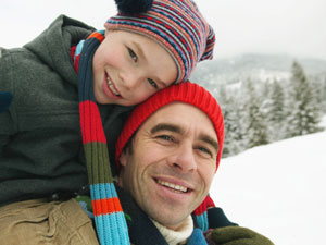 dad and son in snow