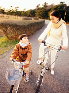 Mom and son riding bike