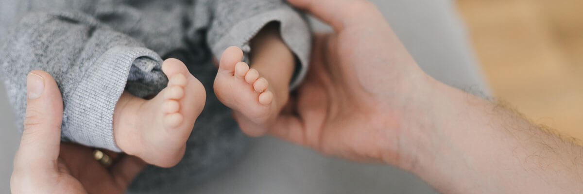 Holding baby's feet