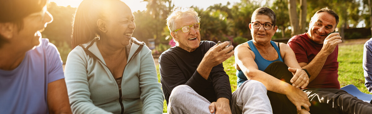 Group of smiling people on grass