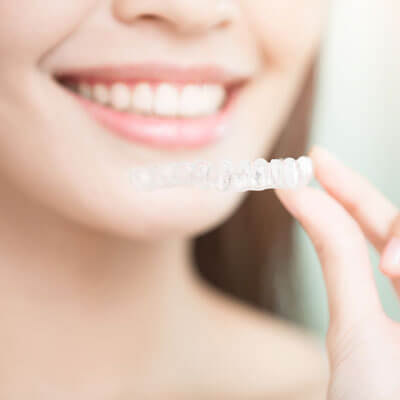 aligner and smiling woman