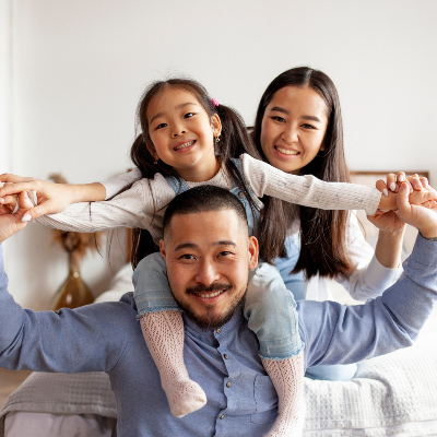 smiling parents with happy toddler