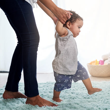Child learning to walk