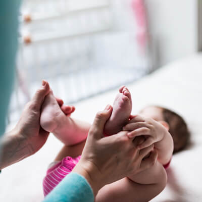 Holding child's feet