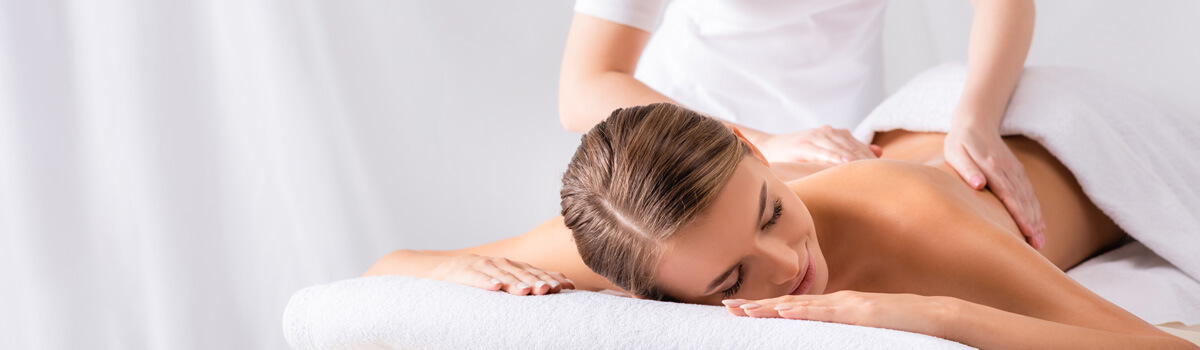 Massage therapist treating a patient