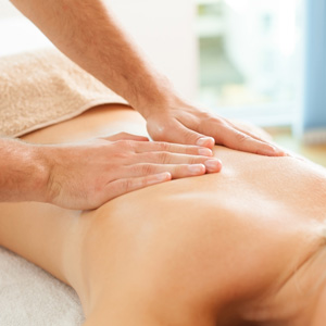 Hands on back giving massage