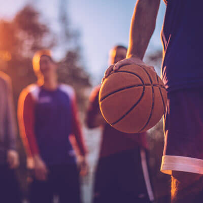 Teens playing basketball