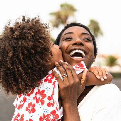 happy mom and kid hugging