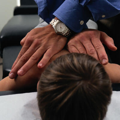 little boy at chiropractic adjustment