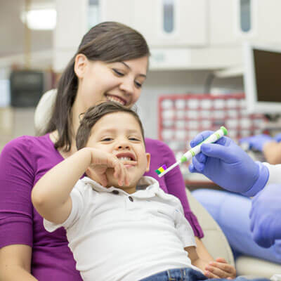 boy and mom at dentist