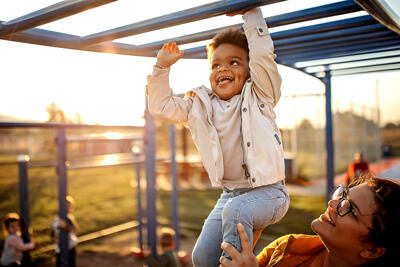 boy on monkey bars