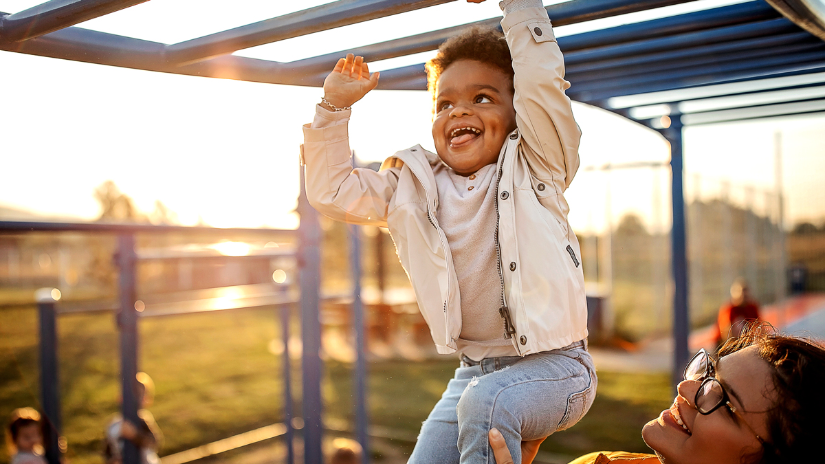 boy on monkey bars