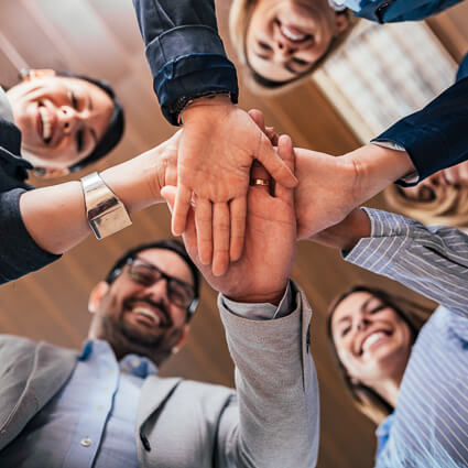 team putting hands together