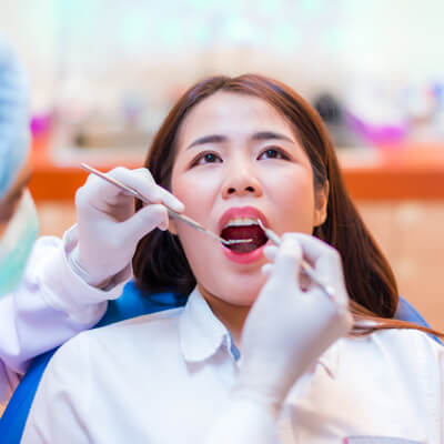 dentist checking teeth
