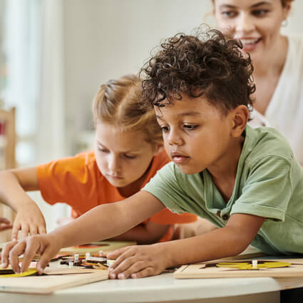 Children working on puzzle