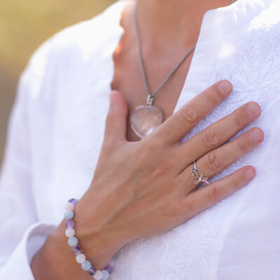 Close up of woman's hand on chest peacefully