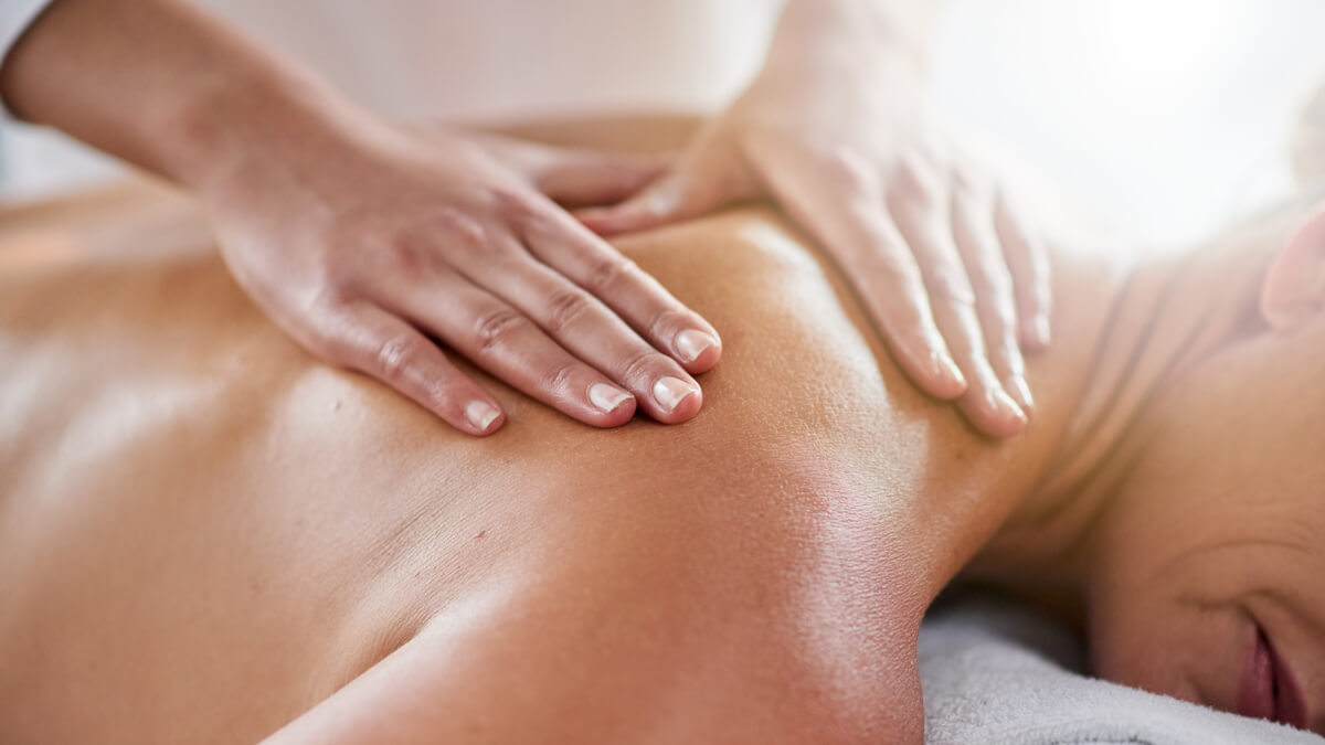 Woman receiving back massage