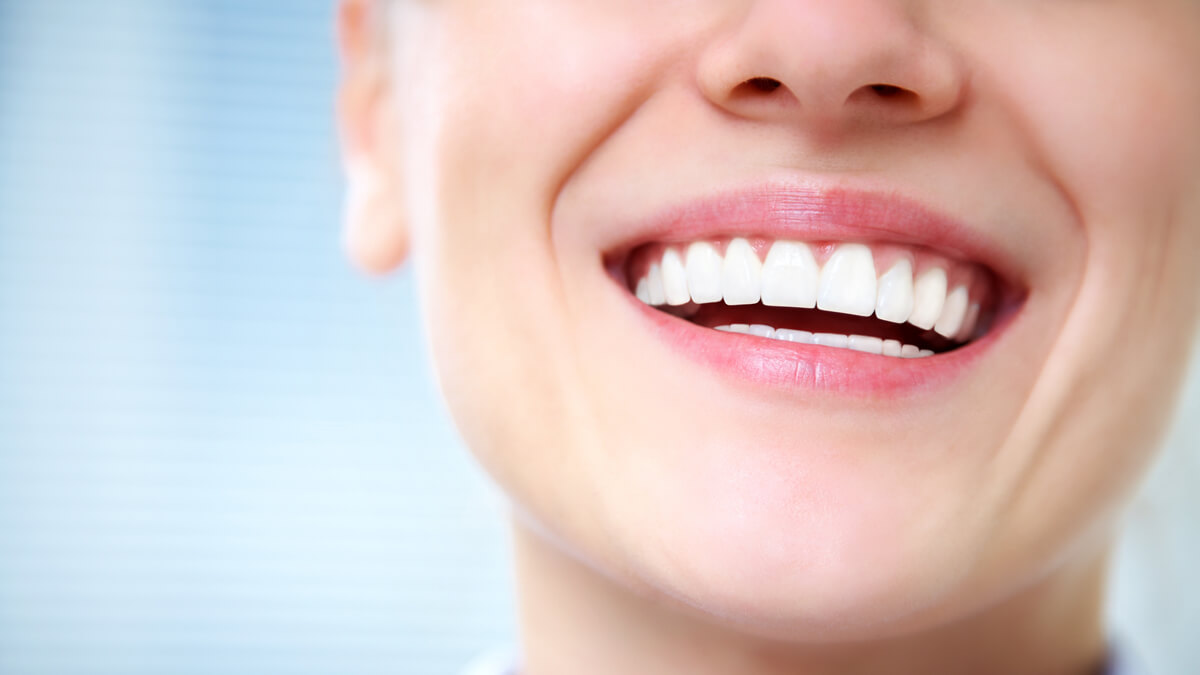 closeup of woman with beautiful white teeth
