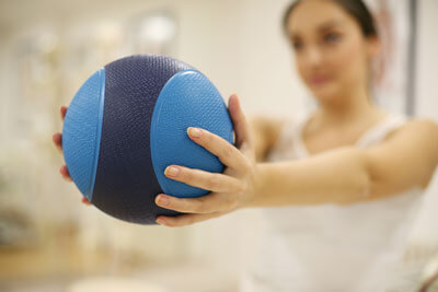 Woman holding exercise ball