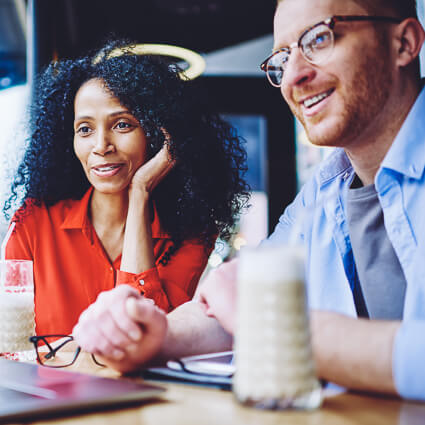 Man and woman looking at laptop