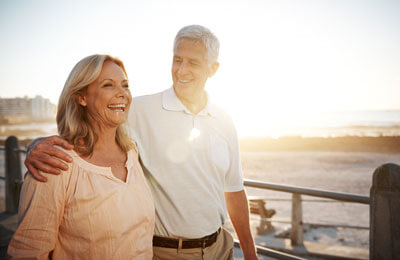 Couple walking outdoors at sunset