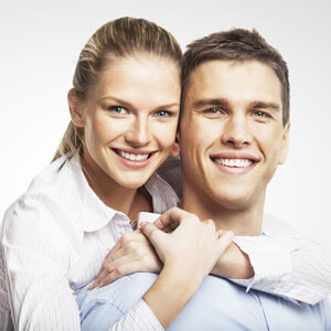 Portrait of couple smiling. Bridges and crowns at First Dental Studio in Brisbane CBD.