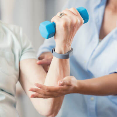 person curling physical therapy weight