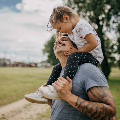 dad gives a piggyback ride