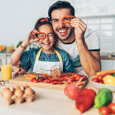 Dad and daughter cooking healthy meal