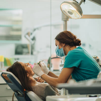 person in dental chair during procedure