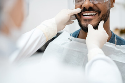 dentist checking smile
