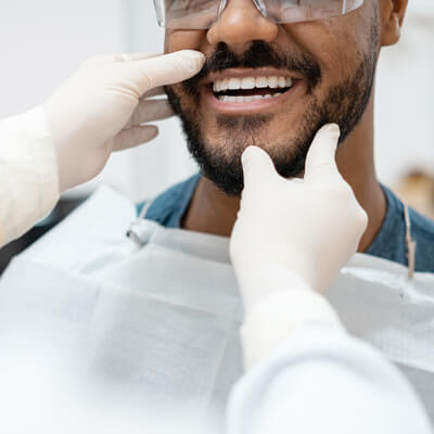 Dental patient having his teeth checked