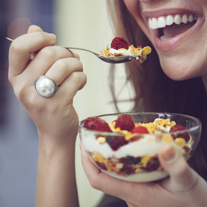 young woman eating cereal