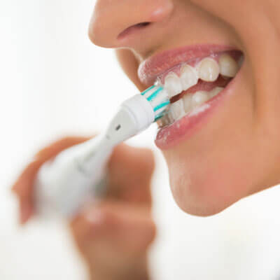 person brushing their teeth