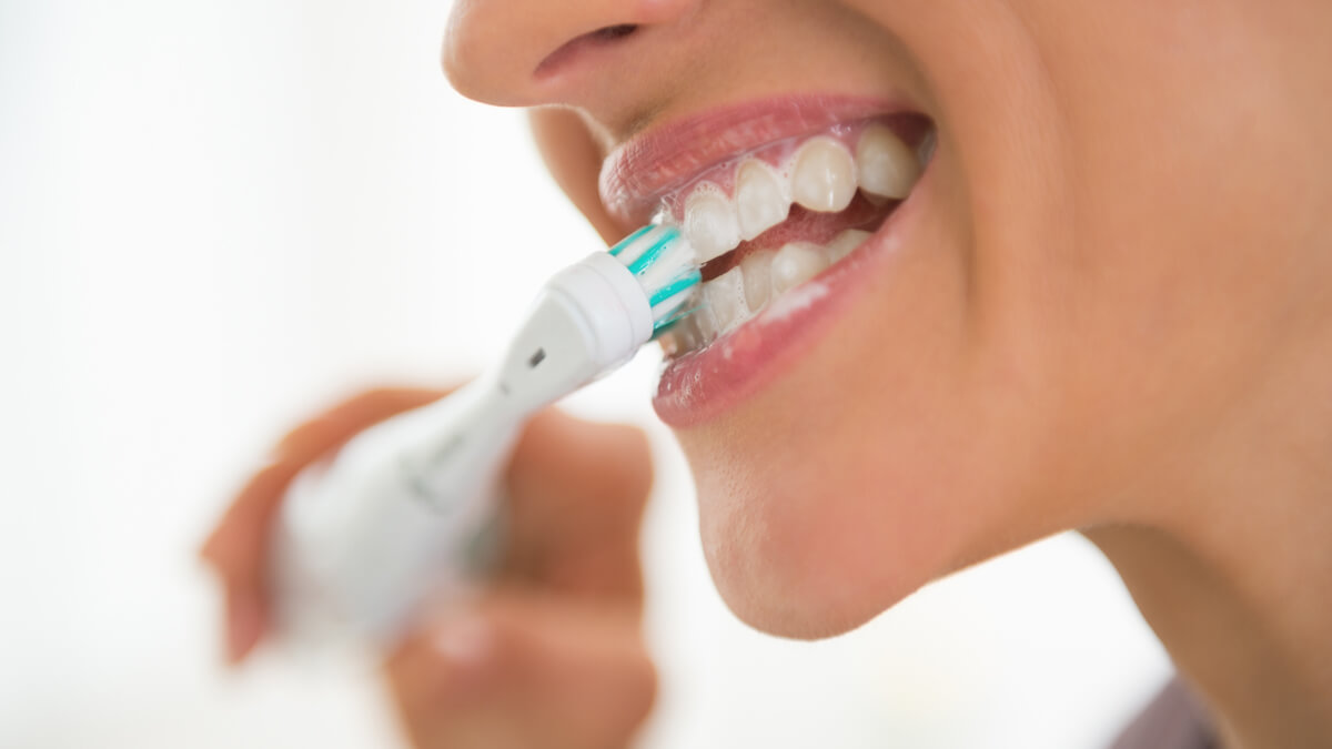 Woman brushing her teeth