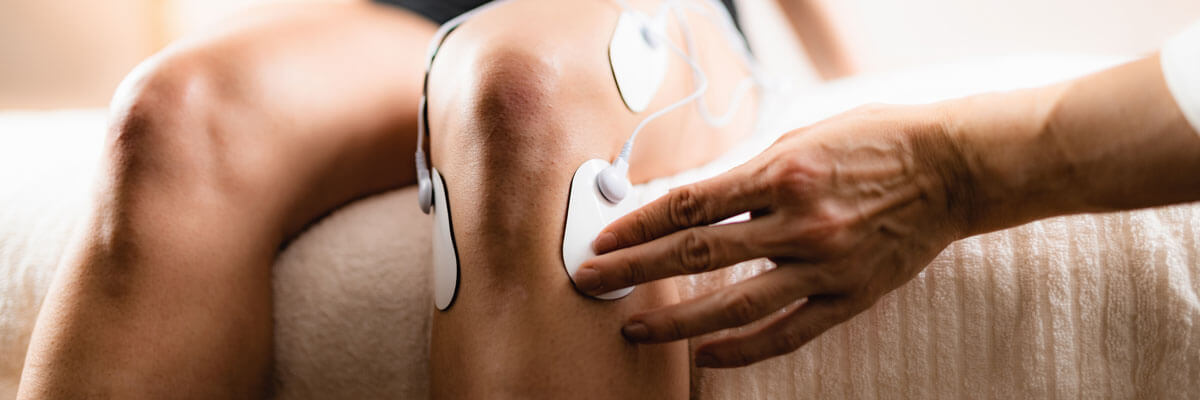 Therapy device being applied to a patient's knee