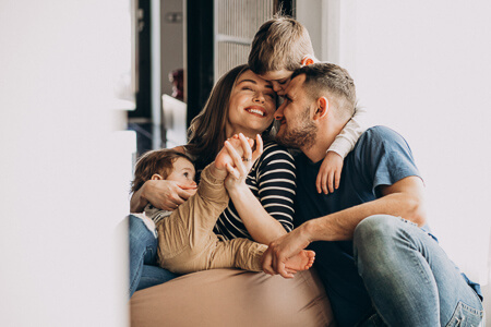 Smiling family of four