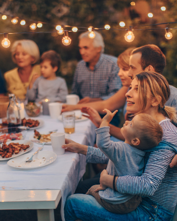 family having dinner outdoors