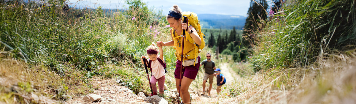 Family hiking up mountain