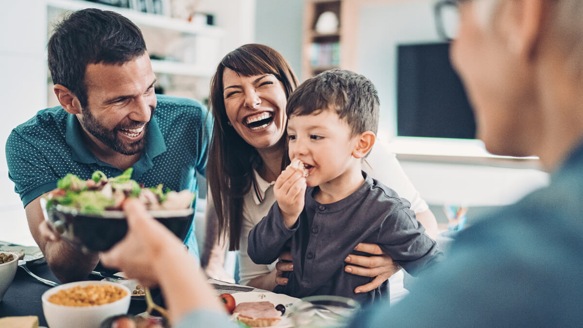 Family laughing and eating