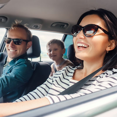 family laughing in the car